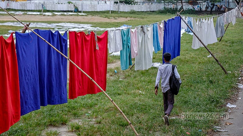 A clothes-drying area has been set up in the free space outside the temporary court in the Alia madrasah field using bamboo and rope. Clothes are being dried on rows of bamboo poles. Photo: Mahmud Zaman Ovi