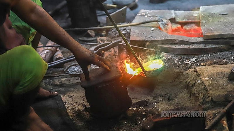 Molten brass is poured into a mould for brass utensils at a factory in Jhaulahati in Dhaka’s Kamrangirchar. Photos: Abdullah Al Momin