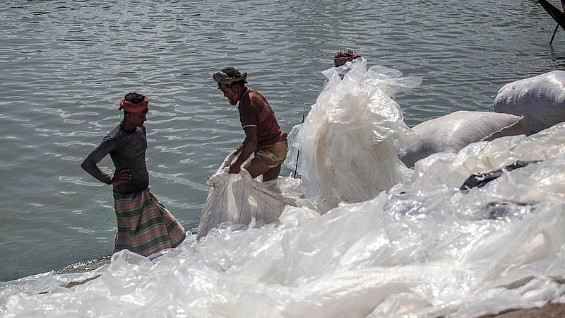 Workers at Dhaka's Islambagh pack washed polythene into sacks for transport. Photo: Abdullah Al Momin