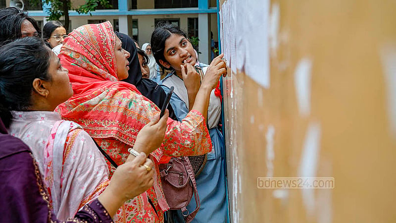 Students of Viqarunnisa Noon School and College check SSC results on the notice board on Sunday, May 12, 2024.