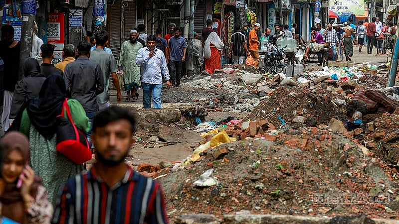 The entire Nazimuddin Road in Old Dhaka has been excavated, forcing people to walk along one side of the road.Photo:Mahmud Zaman Ovi