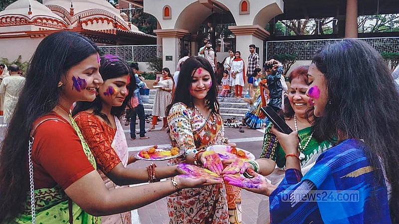 Women put colour on each others’ faces during the Dol Purnima celebrations at the Dhakeshwari Temple on Friday, Mar 14, 2025. Photo: Abdullah al Momin