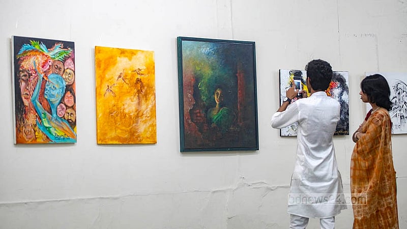 Visitors at the Zainul Gallery of the Faculty of Fine Arts at Dhaka University view works displayed to mark the birth centenary of artist SM Sultan. The exhibition will remain open until Aug 16. Photo: Abdullah Al Momin