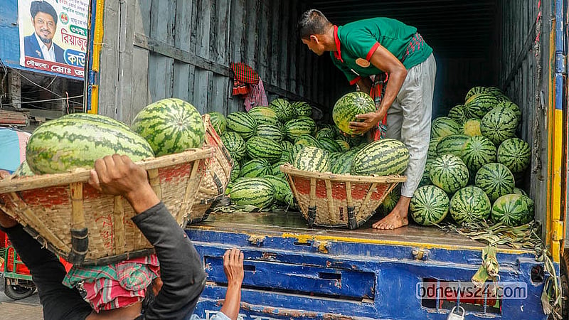 Watermelons from the warehouses in Wiseghat are loaded onto covered vans for transport to Uttara’s Abdullahpur. Photo: Abdullah Al Momin