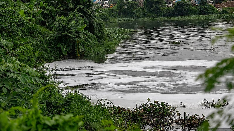 During the monsoon, waste from factories in Mirpur mixes with the new water in the Turag. The addition of the black, chemical-laden factory water leads to foam forming on top of the river. Photo: Mahmud Zaman Ovi