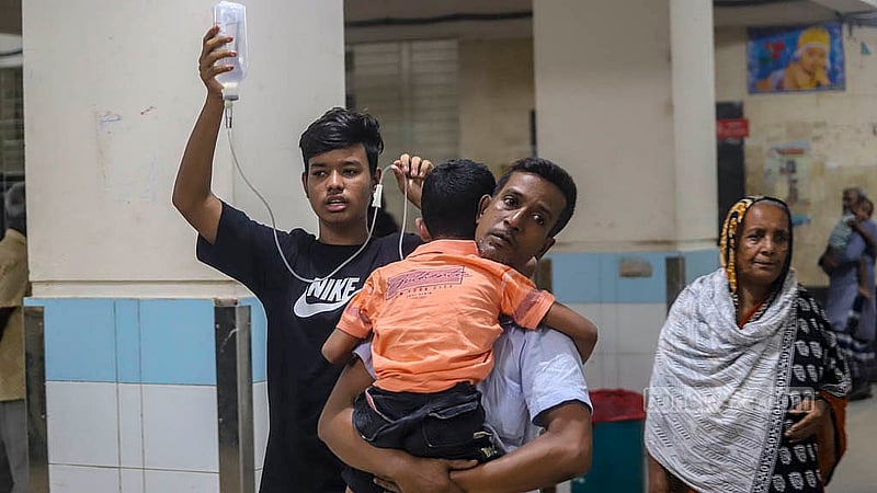 A dengue-afflicted child is being taken for tests at Mugda General Hospital in the capital. Photo: Abdullah al Momin