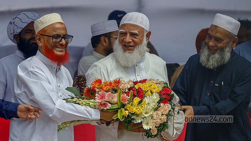 After being acquitted from the death sentence in a war crimes case and released the next day, Jamaat-e-Islami leader ATM Azharul Islam is congratulated by the party's chief Shafiqur Rahman at a reception in Dhaka's Shahbagh on Wednesday, May 28, 2025. Photo: Mahmud Zaman Ovi