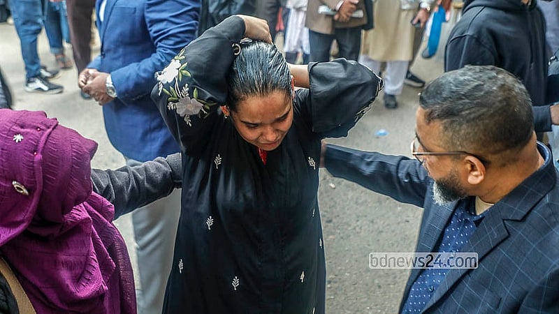 A student breaks down in tears after arriving late because of traffic congestion during the Dhaka University Faculty of Science admission test for the 2025–26 academic year on Saturday, Dec 27, 2025. Photo: Abdullah Al Momin