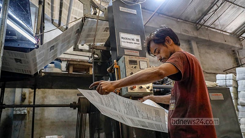 Although there is a rush to hand over new textbooks to students at the beginning of each year, it seems secondary school students will have to wait a bit longer. Presses are working day and night in shifts, but not all the books will be ready before the new year. Photo: Mahmud Zaman Ovi