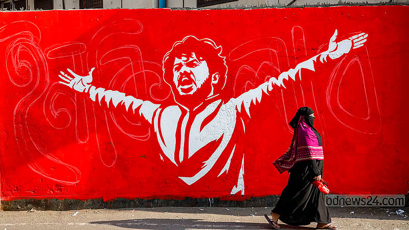 A graffiti portrait of Osman Hadi, the convenor of Inqilab Moncho, covers a wall in front of Hazaribagh Police Station in Old Dhaka. Photo: Mahmud Zaman Ovi