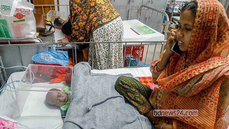 A child admitted to Bangladesh Shishu Hospital &amp; Institute (BSHI) with breathing difficulties is kept in a glass enclosure to maintain oxygen supply. Photo: Abdullah al Momin