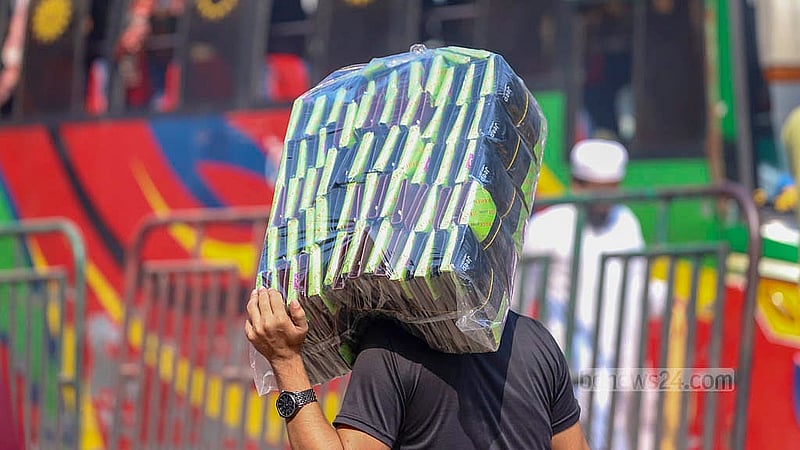 Customers carrying products in plastic packets from a wholesale market in Dhaka. Photo: Abdullah al Momin