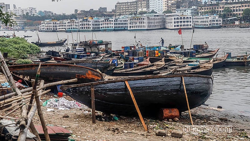 After construction or repairs, boats are coated with tar, which takes several days to dry. Photo: Abdullah Al Momin