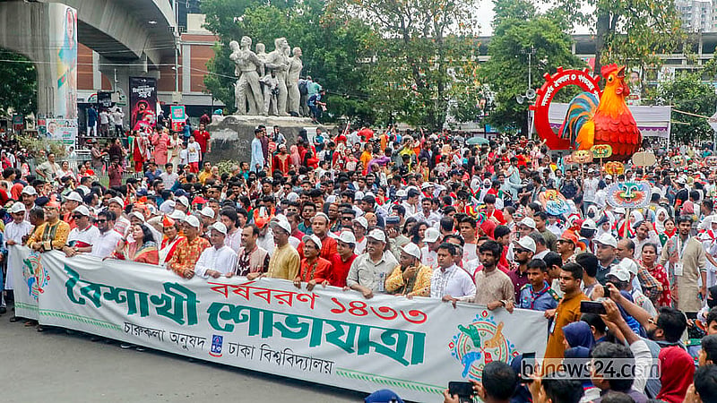 This year’s theme for the Baishakhi Shobhajatra is “Noboborsher Oikotan, Ganatontrer Punurutthan” (New Year in harmony, renewal of democracy). Cultural Affairs Minister Nitai Roy Chowdhury joins the procession led by Dhaka University Vice-Chancellor Prof ABM Obaidul Islam. Photo: Abdullah Al Momin