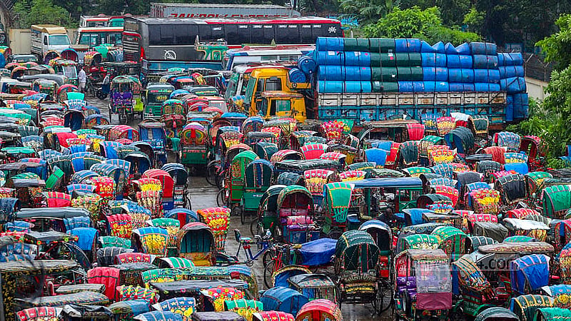Battery-powered rickshaws fill the dumping station on the north side of Dhaka's Postogola Bridge. Photo: Abdullah Al Momin