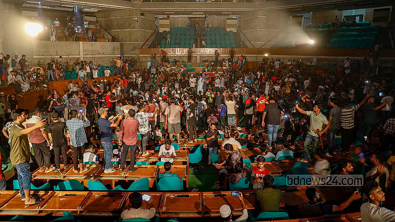 Thousands burst into celebration in the parliament building’s assembly hall. Photo: Mahmud Zaman Ovi