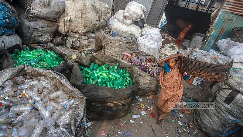 Sacks filled with plastic waste line the outside of a shop in Lalbagh. Photo: Abdullah Al Momin