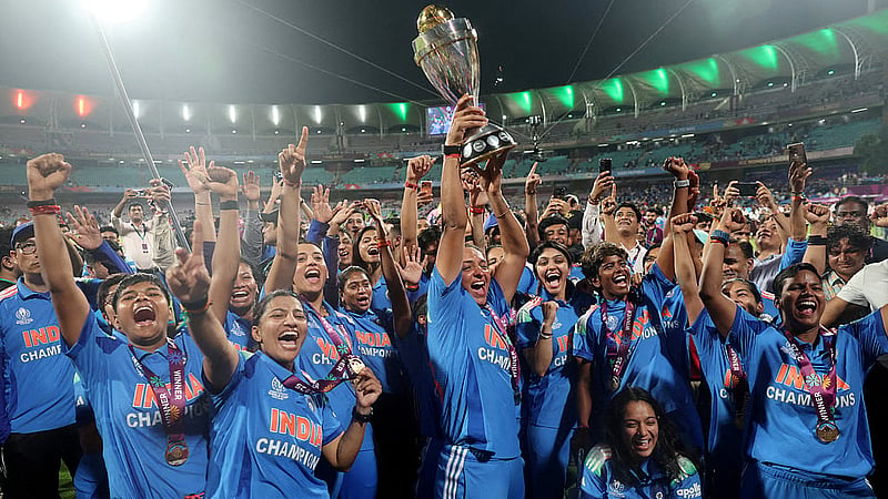 Cricket - ICC Women's World Cup - Final - India v South Africa - DY Patil Stadium, Navi Mumbai, India - Nov 2, 2025 India's Harmanpreet Kaur and teammates celebrate with the trophy after winning the ICC Women's World Cup. REUTERS