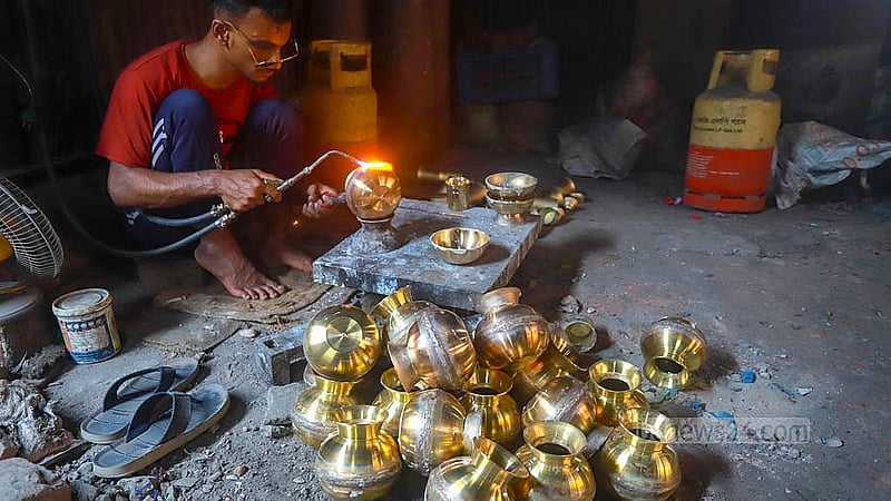 Welding work is conducted after brass utensils are finished at a factory in Jhaulahati in Dhaka’s Kamrangirchar. Photos: Abdullah Al Momin
