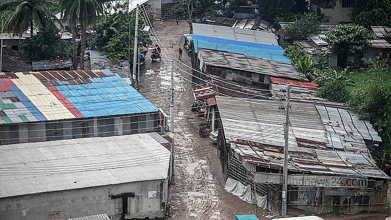 Illegal structures line both banks of Chowdhurypara lake, steadily erasing the waterbody as new settlements emerge. Photo taken on Saturday, Sept 13. Abdullah Al Momin