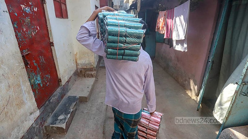 A buyer is returning after purchasing embroidery thread from Benarasi Palli in Dhaka’s Mirpur. Photo: Abdullah al Momin