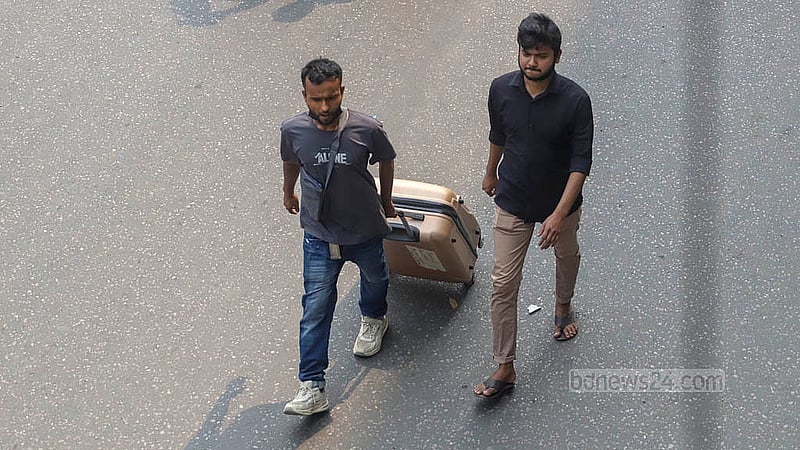 Commuters walk to their destinations on Monday, Mar 10, 2025, after traffic was halted at Chairman Bari U-turn in Banani, where garment workers blocked the road following the death of a female colleague in a road accident. Photo: Abdullah al Momin