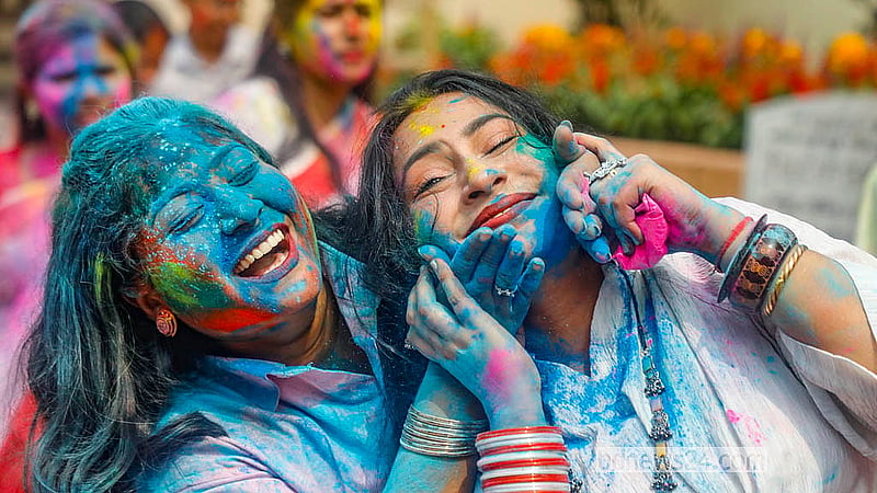 Loved ones apply colours to each other at Dhakeshwari Temple on Tuesday, Mar 3, 2026. Photo: Abdullah Al Momin