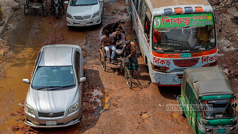 The road to Hanif Flyover via Tikatuli in Dhaka is in such bad condition that even private car and bus drivers struggle to drive on it. Photo: Mahmud Zaman Ovi