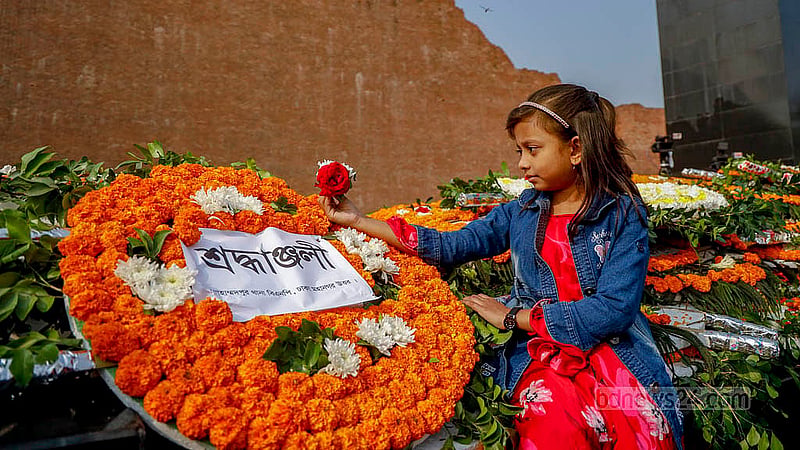 Children visit the Rayer Bazaar Massacre Memorial to honour the nation's greatest minds on Martyred Intellectuals Day. Photo: Mahmud Zaman Ovi