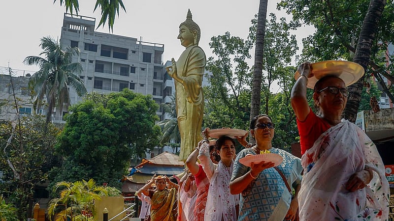People celebrate Buddha Purnima, or Boishakhi Purnima, the largest religious festival of the Buddhist community, with different programmes organised at the Dharmarajik Buddhist Monastery in Sabujbag on Sunday. Photo: Mahmud Zaman Ovi