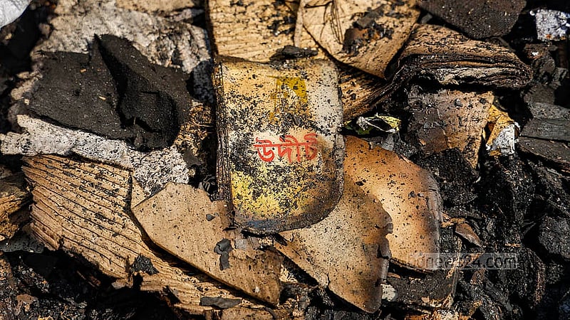 Different books, documents, posters, and placards burnt in the attack and arson on Dec 19 last year are displayed in bags outside the central office of the cultural organisation Udichi Shilpigosthi on Tuesday, Jan 13, 2026. Photo: Mahmud Zaman Ovi