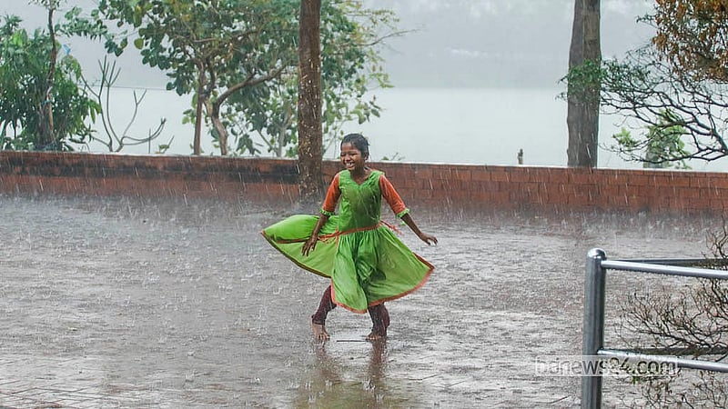 A child plays in the rain in Dhaka’s Hatirjheel on Monday, Mar 2, 2026. Photo: Abdullah Al Momin