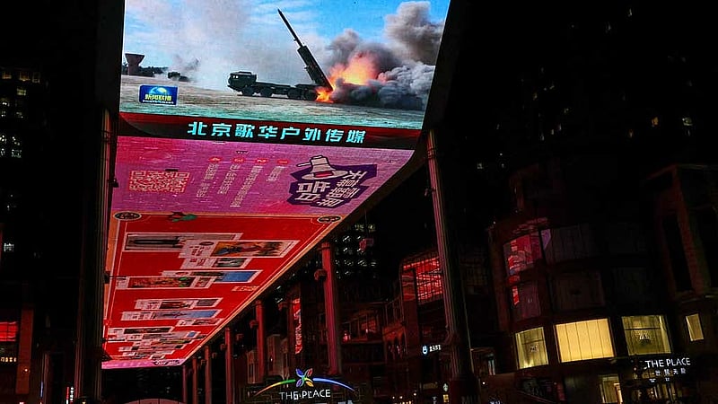 A giant screen shows a news report on China's &amp;quot;Justice Mission 2025&amp;quot; military drills around Taiwan, in Beijing, China December 30, 2025. REUTERS