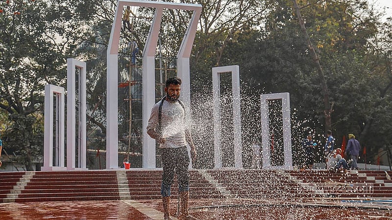 In preparation for Feb 21, the Central Shaheed Minar is being washed, with workers spraying water across the premises on Monday, Feb 16, 2026. Photo: Mahmud Zaman Ovi
