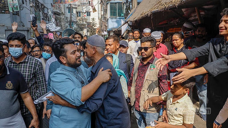 Dhaka-11 election candidate Nahid Islam hugs voters in Chowdhurypara on Wednesday, Feb 4, 2026. Photo: Mahmud Zaman Ovi