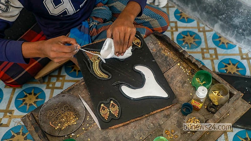 Artisans in Savar’s Bhakurta use plaster to secure jewellery pieces for precision soldering after the initial design is set. Photo: Abdullah Al Momin