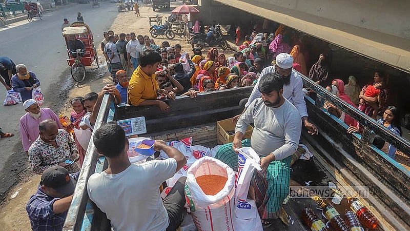 Each TCB truck can sell subsidised necessities to 400 people. People desperately crowd around one such truck in Karwan Bazar until its stock runs out. Photo: Abdullah al Momin