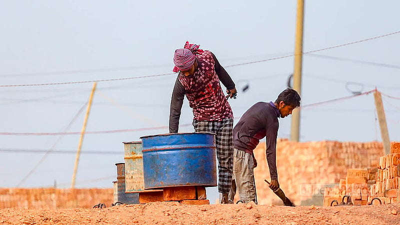 Workers put coal into the kilns at a brickfield at South Keraniganj's Jazira. Photo: Abdullah al Momin