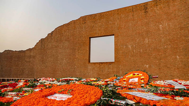 The Rayer Bazaar Massacre Memorial is filled with tributes of flowers from people of all walks of life on the Martyred Intellectuals Day. Photo: Mahmud Zaman Ovi