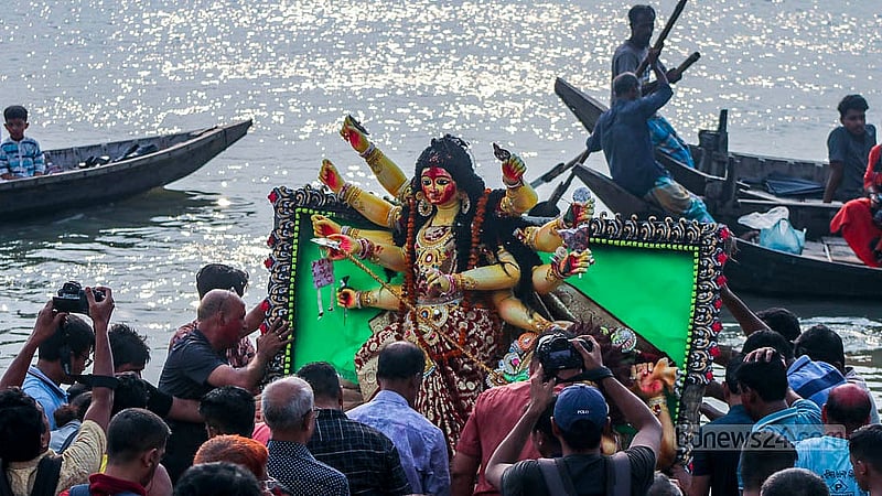 Hindu devotees bid farewell to Goddess Durga through idol immersion at Buriganga River in Dhaka’s Bosila on Sunday, Oct 13, 2024. Photo: Shamim-Us-Salehin