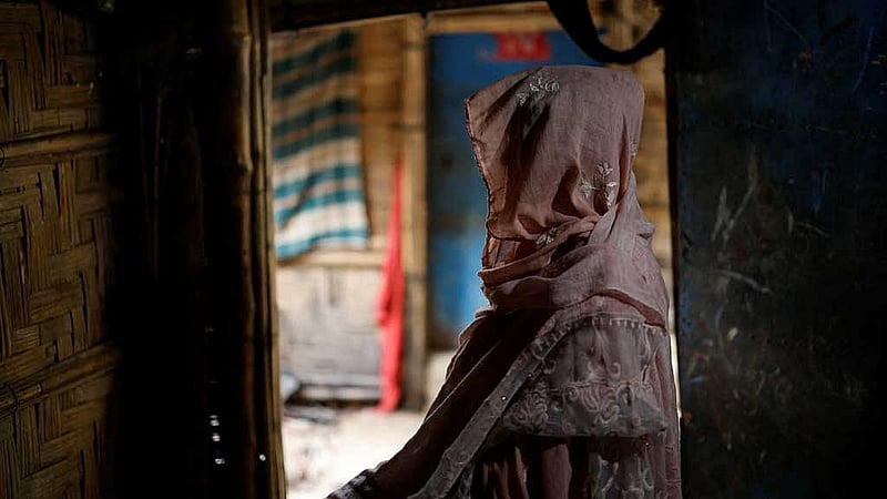 Ajib Bahar, 38, a newly-arrived Rohingya refugee poses for a picture inside her shelter at a refugee camp in Cox's Bazar, Bangladesh, Aug 27, 2025. REUTERS/Mohammad Ponir Hossain