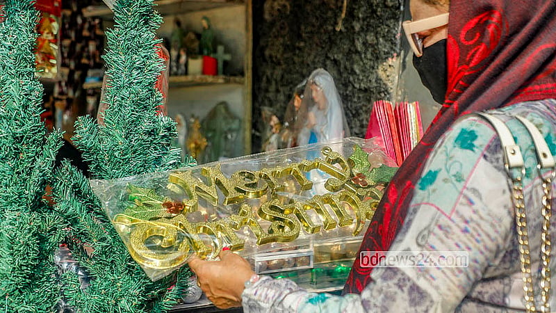 Many buy Christmas decorations from a temporary stall outside the Holy Rosary Church in Tejagon, Dhaka. Photo: Abdullah Al Momin