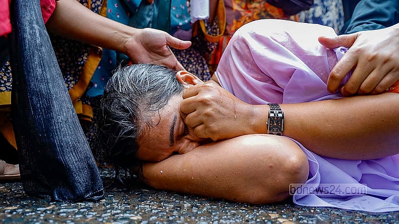 A protesting woman is seen lying on the street after police used water canons to disperse protesters demanding the reinstatement of cancelled appointment for primary school assistant teacher during a sit-in demonstration at Shahbagh Intersection on Thursday, Feb 13, 2025. Photo: Mahmud Zaman Ovi