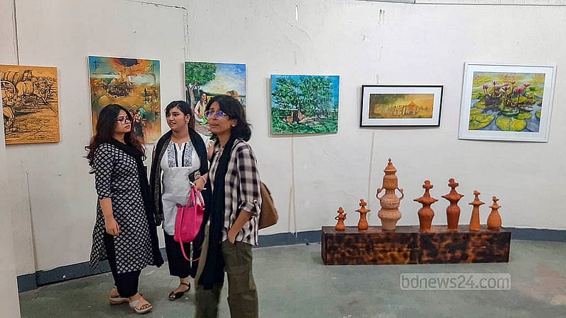 Visitors at the Zainul Gallery of the Faculty of Fine Arts at Dhaka University view works displayed to mark the birth centenary of artist SM Sultan. The exhibition will remain open until Aug 16. Photo: Abdullah Al Momin