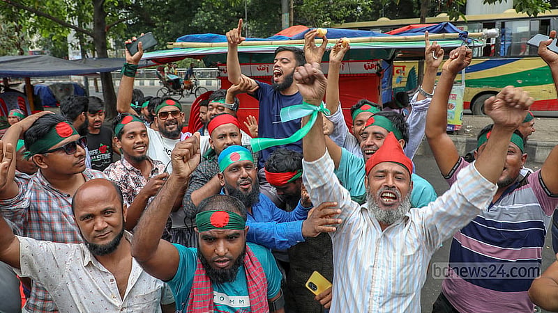 An organisation called July Revolution Army distributes sweets in Shahbagh on Monday, May 12, 2025, to celebrate the interim government’s decision to ban activities of the Awami League which was ousted in the July Uprising. Photo: Mahmud Zaman Ovi