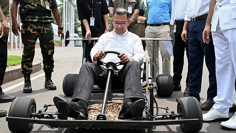 Prime Minister Tarique Rahman encourages college student Rezwan Rashid by driving a go-kart (racing car) built by him. The head of state drives the go-kart at the Tejgaon office premises on Saturday, Apr 25, 2026. Photo: PMO