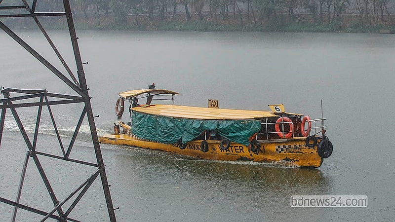 A water taxi plies in the rain at Dhaka’s Hatirjheel on Monday, Mar 2, 2026. Photo: Abdullah Al Momin