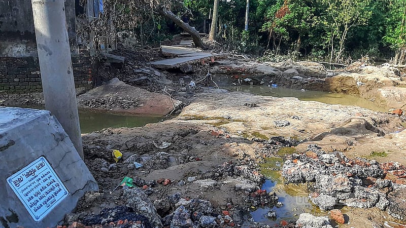 A plaque of the road linking Jagatpur and Amjar Haat in Fulgazi Upazila can be seen floating a few hundred feet away. Photo: Uttam Sen Gupta