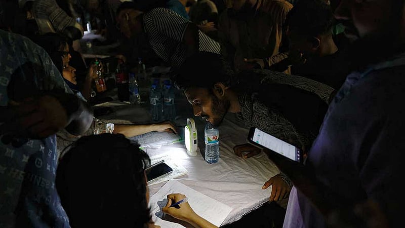 Volunteers collect contact information from potential blood donors if blood is needed for the victims, in front of a hospital, after an air force training aircraft crashed into a building belonging to Milestone School and College, in Dhaka, Bangladesh, Jul 21, 2025. REUTERS/Mohammad Ponir Hossain