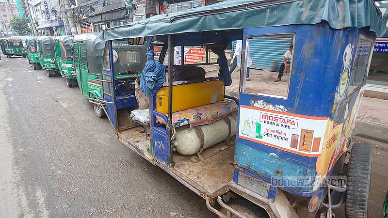 An unfit and unlicensed autorickshaw waits to fill up with gas at a CNG filling station in Dhaka's Mugda area. Photo: Abdullah Al Momin